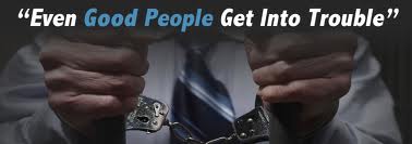 Image of person's hands in handcuffs